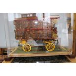 A model of a 'Showmans Caravan' in perspex case