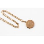 A round locket and chain, unmarked rose metal, inscribed, on a 15ct gold chain stamped 15ct,