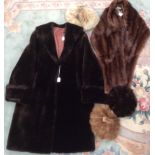 A dark brown faux fur coat late 1950 and a brown mink hat mid brown and a dark brown mink fur hat,