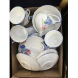 An Art Deco Floral pattern part tea set with white ground. One box.