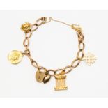 A 9 ct gold charm bracelet with various charms including St Christophers, crab, Roman Pillar etc,