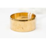 A 9ct gold wedding band, width approx 10mm with bevelled edge, size V, weight approx 6.