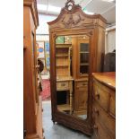 A 19th Century French Kingwood veneered armoire, having a central mirrored door, 200cm high,