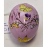 A 19th century continental painted decorative porcelain egg
