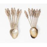Six Apostle spoons with shell shaped bowls, London 1899, together with six Apostle spoons,