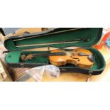 A violin with Spurious 'Stradivarious' label, length of back 14" in case,