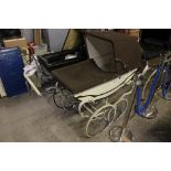 Three vintage baby carriages/prams to include; Wilson - Silver Shadow Motel;
