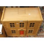 One wooden dolls house with contents,
