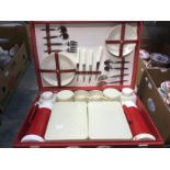 A vintage picnic set (four piece) with Brexton bottles,