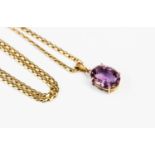 A 9ct gold amethyst single stone pendant, the claw set oval cut amethyst approx 13mm x 9mm,