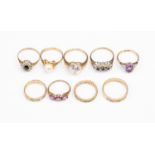 A collection of nine 9ct gold rings, including a pearl set solitaire,