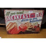 A reproduction advertising plaque 'Breakfast in Bed'