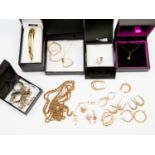 A collection of 9ct gold jewellery including hoop earrings, bangles, chains,