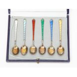 A cased set of six Danish Silver and Enamel spoons.