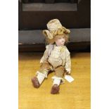 Small bisque headed boy doll with bisque body