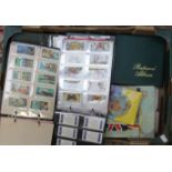 A large collection of vintage cigarette cards, tea cards, including Brooke Bond,