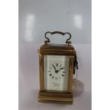 A miniature brass cases carriage clock,