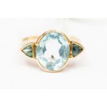 A sky blue topaz dress ring, set with a central oval blue topaz approx 9mm x 11mm,