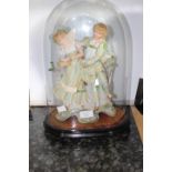 Early 20th century glass dome with a continental figure inside,