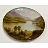 Large charger, hand painted with lake and mountainous scene, indistinctly marked with pencil,