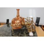 A working part model of a Still - from Tunnel Refineries (sugar) copper and brass,