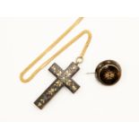 A tortoise shell and pique work cross on a 9ct gold locket and brooch