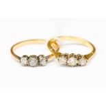 An 18ct gold and three stone diamond ring, size M, with a total gross weight approx 2.