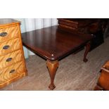 A late Victorian mahogany extending dining table, complete with two removable leaves,