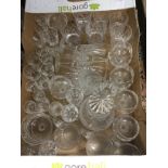 A quantity of cut glass including champagne flutes, tot glasses, port glasses,