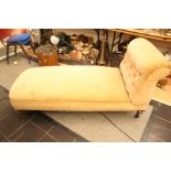 A Victorian cream upholstered chaise longue,