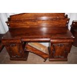 An early Victorian mahogany twin pedestal sideboard, 199cm high, 142cm wide,
