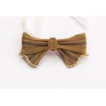 A tri-coloured 9 ct gold bow brooch,