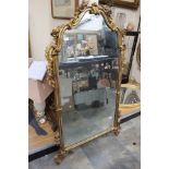 A Georgian style Chinoiserie giltwood mirror, the top section missing, the sides carved with flower,