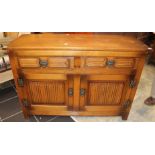An Old Charm oak sideboard, fitted with two drawers with linenfold decoration,