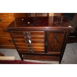 An Edwardian mahogany music cabinet,