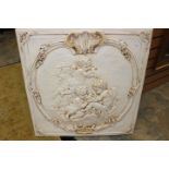 An 18th Century style white painted plaster cast, with putti in relief,