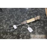 A Victorian ivory and silver mounted toasting fork