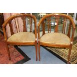 A pair of Edwardian mahogany Bergere chairs with boxwood inlay, padded seats,