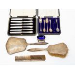 A collection of silver including silver - mounted hair brush, comb and mirror, fruit knives,