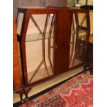A George V Art Deco mahogany display cabinet, the frame of angular form,