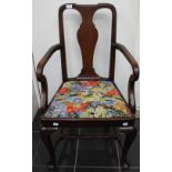 An early 20th Century Queen Anne style mahogany open armchair, fitted with a drop in seat,