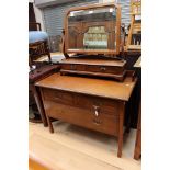An Edwardian mahogany dressing chest, comprising two short and one long drawer,