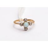 An 18ct gold opal and diamond, round opal set to the centre,