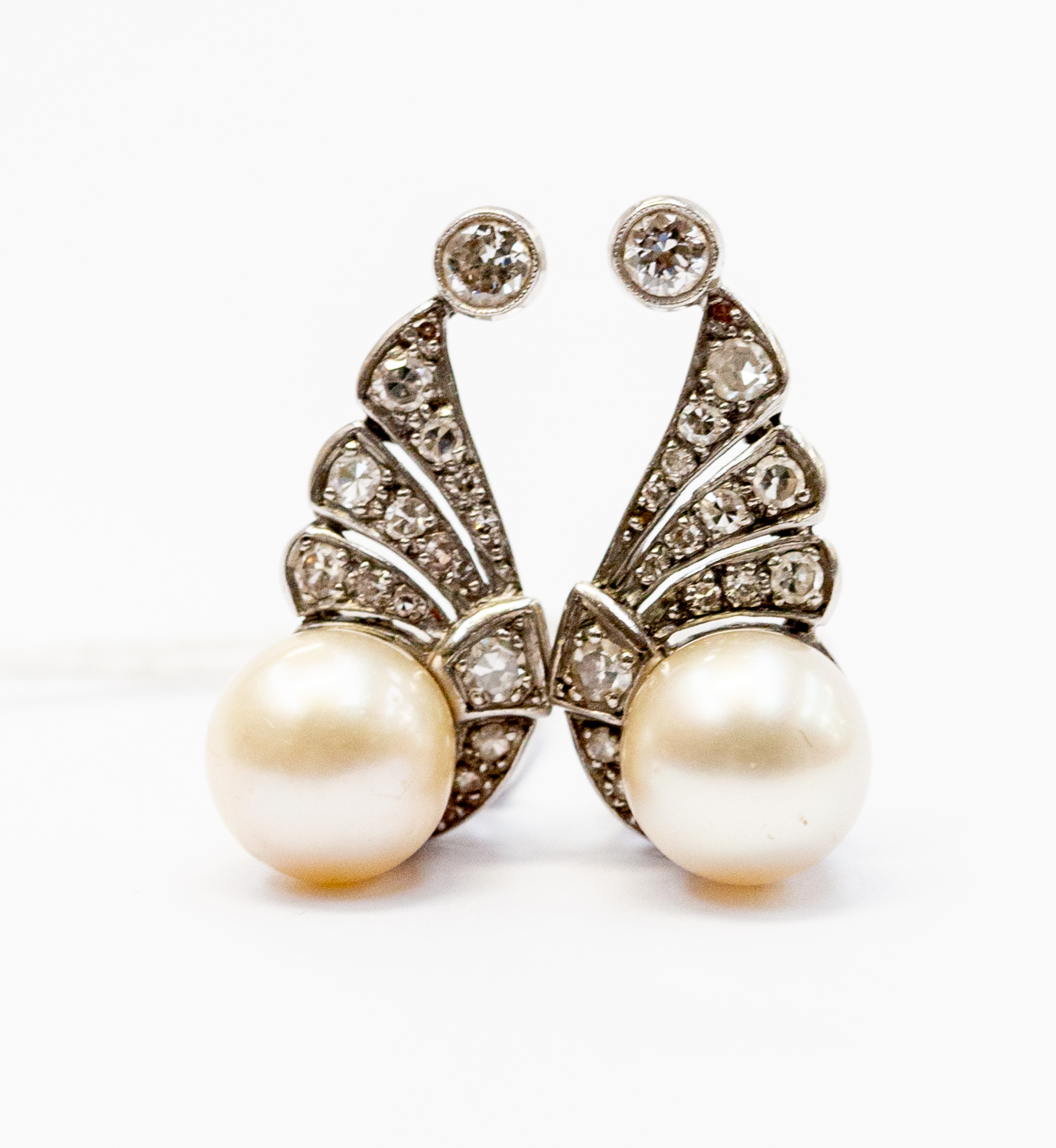 A pair of Art Deco diamond and pearl set earrings/clips,