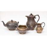 An early Victorian Chinoiserie silver teaset comprising; teapot, hot water jug, milk jug,