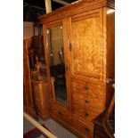 An Edwardian satinwood bedroom suite, comprising single door wardrobe, marble topped washstand,