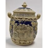 Stoneware embossed twin handled Christmas jar probably Rumtopf with German inscription to rim