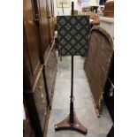 An early 19th Century rosewood pole screen, woolwork panel, turned and reeded column,