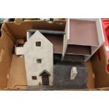 A dolls house together with furniture