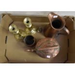 An early 19th century copper kettle and a pair of brass candlesticks,